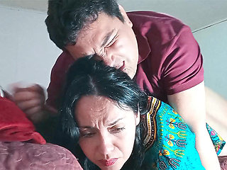 Indian stepmother shares bed with her stepson, they end up fucking hard.